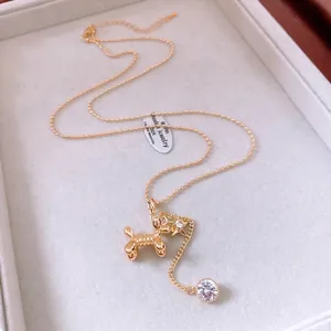 14K gold plated necklace featuring a balloon dog pendant with star and zircon accents