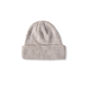 Detailed close-up of a light grey knitted beanie with classic vertical ribbing and cuff