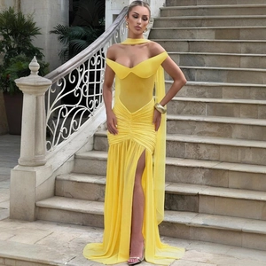 Detail of yellow backless tube dress with mesh ruching and thigh-high side slit