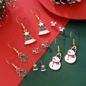 Detailed view of Christmas earring set with reindeer, trees, and snowmen in enamel alloy