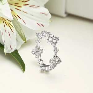 Macro shot of S925 sterling silver ring showing floral design and hallmark detail
