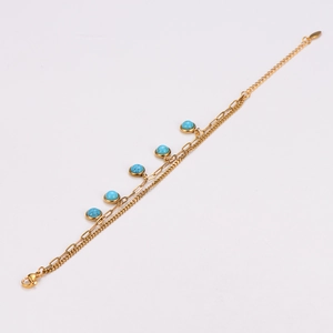 Golden stainless steel double-layered bracelet with turquoise beads on a white background