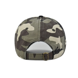 Detail of camouflage baseball cap showing cotton canvas texture and adjustable metal buckle