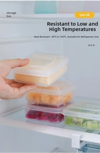 Stackable plastic fridge organizers with lids containing sliced fruit and cheese