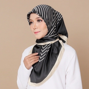 Elegant black and white striped satin square scarf styled as a headscarf on a model