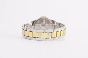 Detailed close-up of two-tone gold and silver link strap on a quartz watch