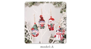 Close-up of wooden Christmas ornaments featuring Santa and Snowman with twine strings