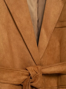 Close-up of lapel and waist tie detail on a camel faux suede long blazer coat