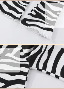 Détail de legging côtelé zébré avec ourlet ondulé à volants et couture latérale soignée
