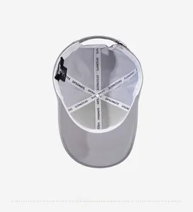 Interior view of grey cotton baseball cap featuring reinforced seams and brand label