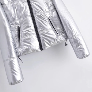 Metallic silver puffer jacket with hooded design and shiny coated finish for winter