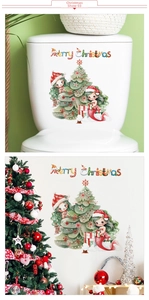 Detail of Christmas tree and mermaid wall decals with Merry Christmas lettering