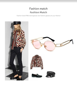 Steampunk sunglasses with pink lenses and gold metal frames on fashion model