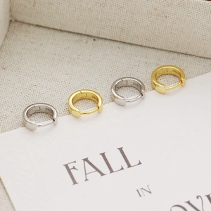 Detailed view of S925 sterling silver hoop earrings in silver and gold with hallmark