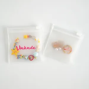 Macro view of matte EVA frosted jewelry pouches with beads and earrings