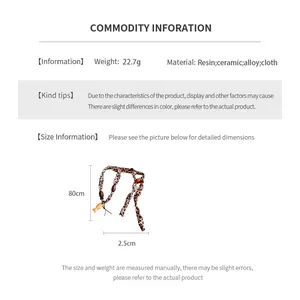 Detail showing dimensions of fish pendant necklace with resin and ceramic beads