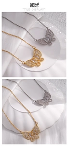Detail of gold and silver butterfly pendants with micro-paved white zircon stones