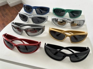 Top view of Y2K oval sunglasses collection in assorted vibrant colors and futuristic frames