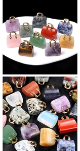 Macro shot of assorted natural crystal stone mini handbag pendants with metal handles