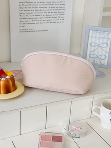 Minimalist light pink large capacity makeup bag with smooth finish and top zipper