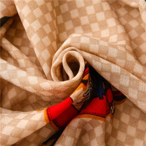 Macro detail showing soft cotton-linen fabric texture with artistic carriage patterns