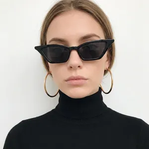 Retro triangle cat eye sunglasses in black with large gold hoop earrings for women