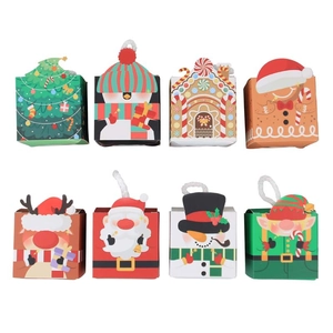 Set of 8 festive Christmas paper gift boxes with various holiday patterns and white rope handles