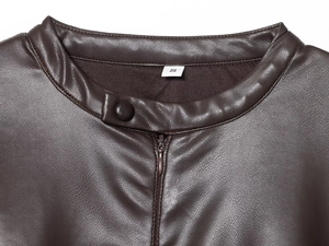 Detail view of round neck and zipper on dark brown PU leather dress with S size tag