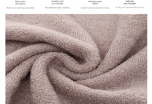 Close-up of soft pink cotton towel showing high-absorbency terry loop texture and fabric
