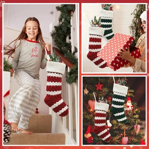Knitted Christmas stockings with red and green stripes and polka dots for holiday gifts