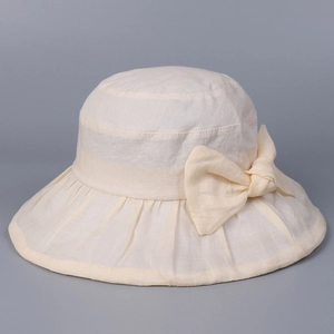 Detail view of the breathable ramie fabric and elegant bow knot on the sun hat