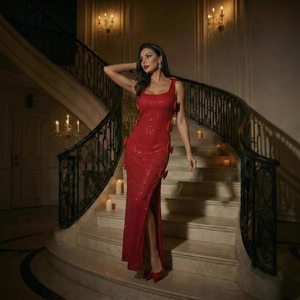 Sparkly red sequin evening dress with waist bow and high slit for party events