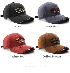 Close-up of four colors of vintage washed baseball caps with New York embroidery details