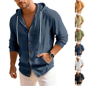 Detailed macro view of the linen cotton fabric texture and wooden buttons on hooded shirt