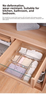 Close-up of a clear PET organizer drawer with socks and fabric items for organization
