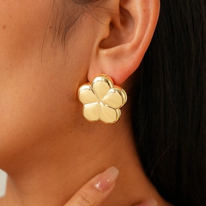 Minimalist gold flower stud earrings with a glossy metal finish for women