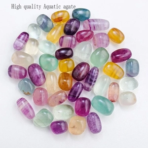 High quality natural aquatic agate tumbled stones in various colors on white background
