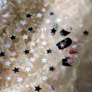 Romantic glittering star nail stickers in black, white, and pink with holographic accents