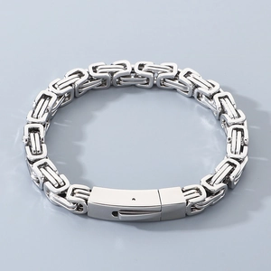 Macro detail of silver Byzantine chain bracelet with secure fold-over clasp for men