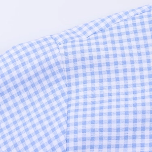 Close-up of blue and white gingham pattern with high-quality shoulder stitching