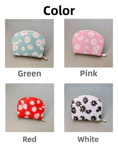 Detail of four colorful daisy pattern PU leather coin purses with sturdy metal zippers