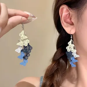 Elegant hollow butterfly tassel earrings with colorful multi-layer drop design for women
