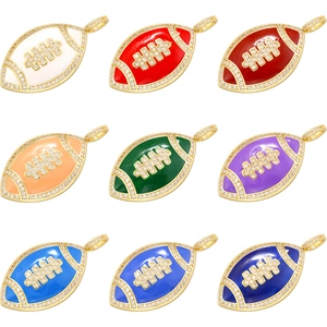 Macro shot of colorful enamel football pendants with cubic zirconia gold plating