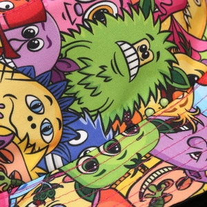 Reversible bucket hat featuring colorful cartoon prints and durable double-stitched seams