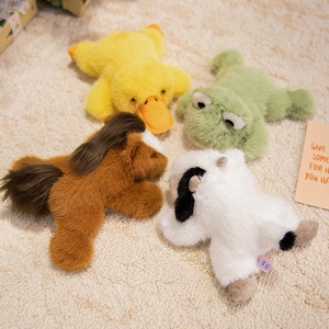 Soft plush animal collection featuring duck, frog, horse, and cow on cozy white rug