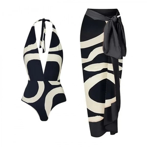 One-shoulder bikini set with matching high-waisted floral cover-up sarong skirt