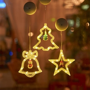Warm white LED Christmas suction cup lights in bell, tree, and star shapes for window