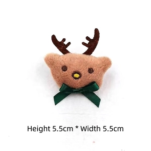 Detail showing plush Christmas reindeer accessory with green bow measuring 5.5cm by 5.5cm
