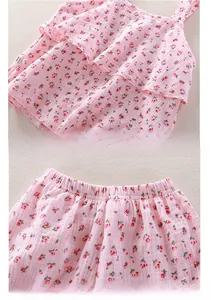 Detail of pink floral cotton double gauze baby set with elastic waist and ruffled hem