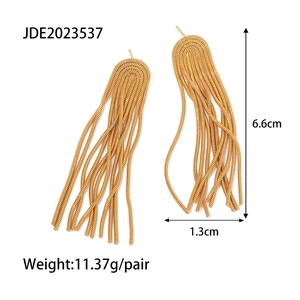 Detail of gold tassel earrings showing dimensions of 6.6cm by 1.3cm in polished finish